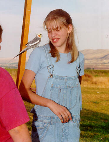 Orton02-Cockatiel-perching on girls shoulder-by S Thomas Lewis.jpg